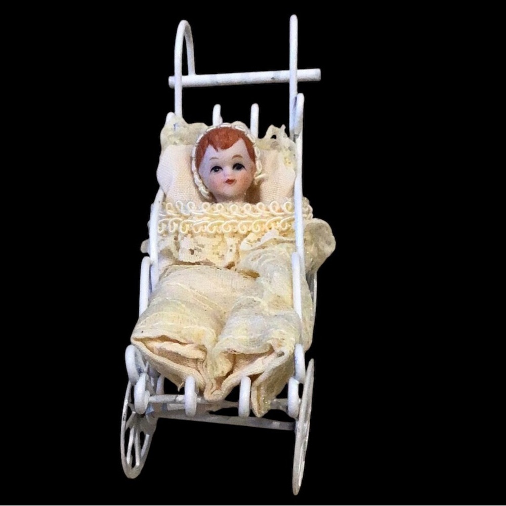 Bisque Porcelain Babydoll in Metal Carriage Ornament
